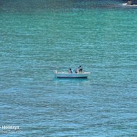 Boat and turquoise sparkling water